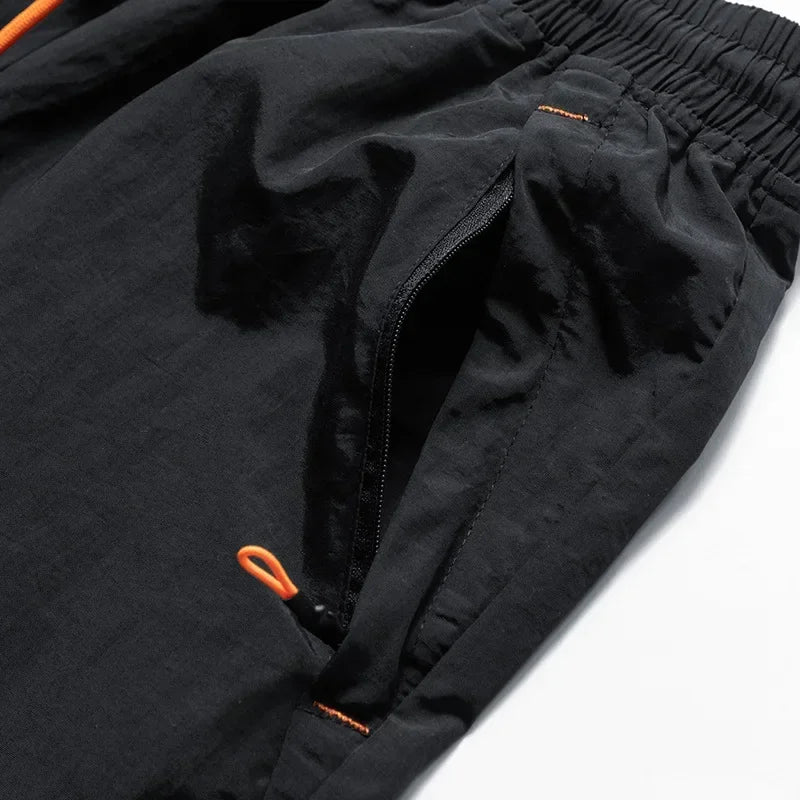 Herren Laufshorts mit Mesh-Innenshorts und Reißverschlusstaschen – Nikoas